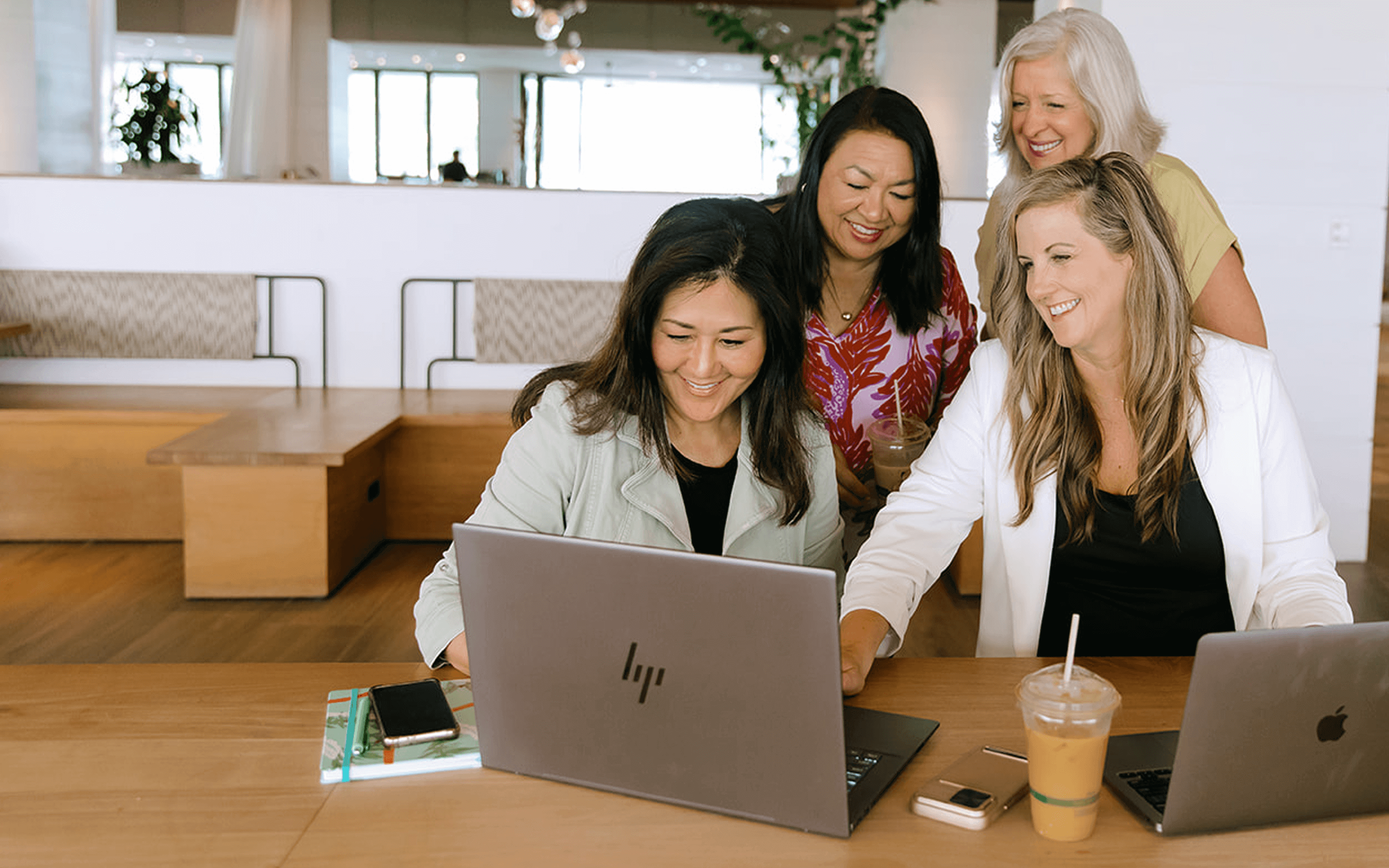 career coaches around a computer