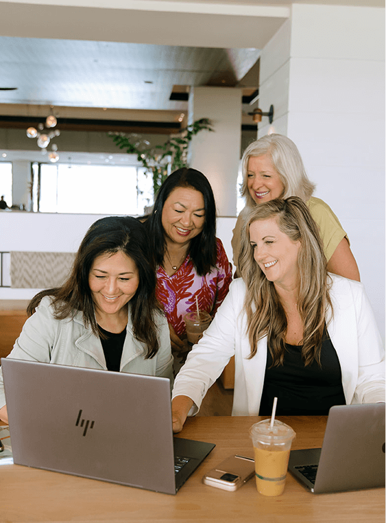 career coaches around a computer