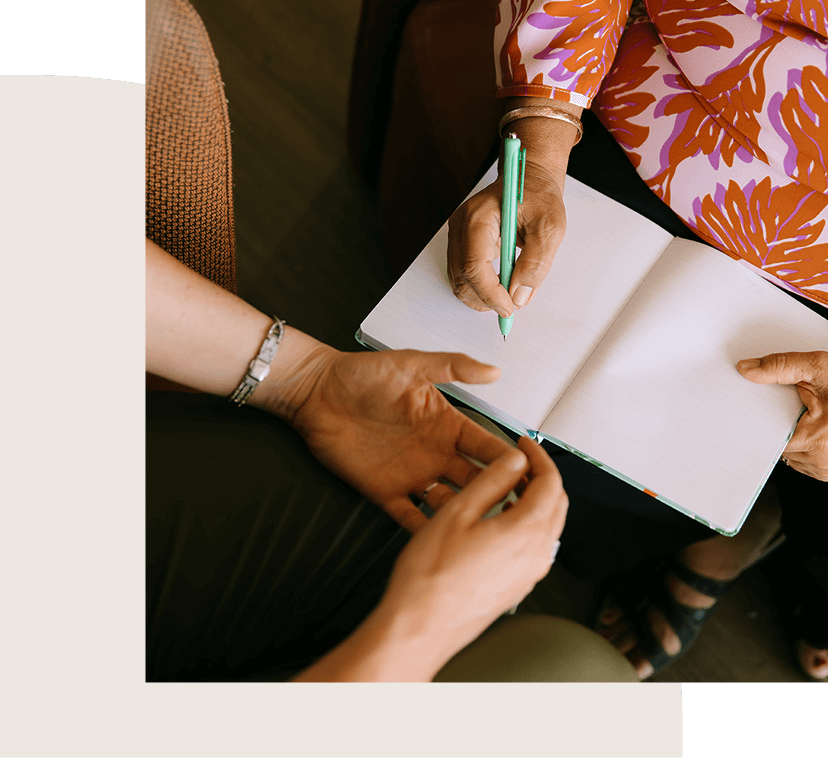 women writing in a book