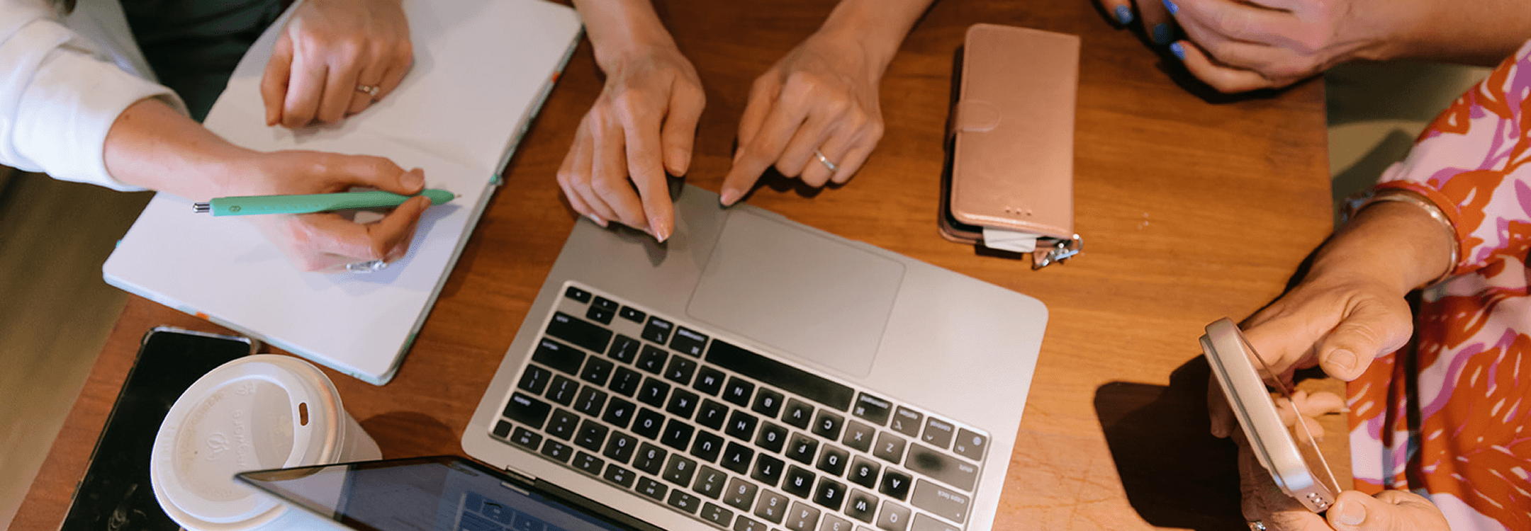 women working around a computer