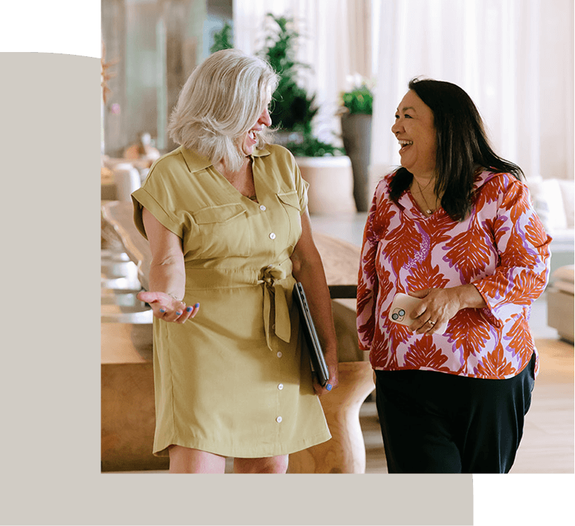 women walking and laughing