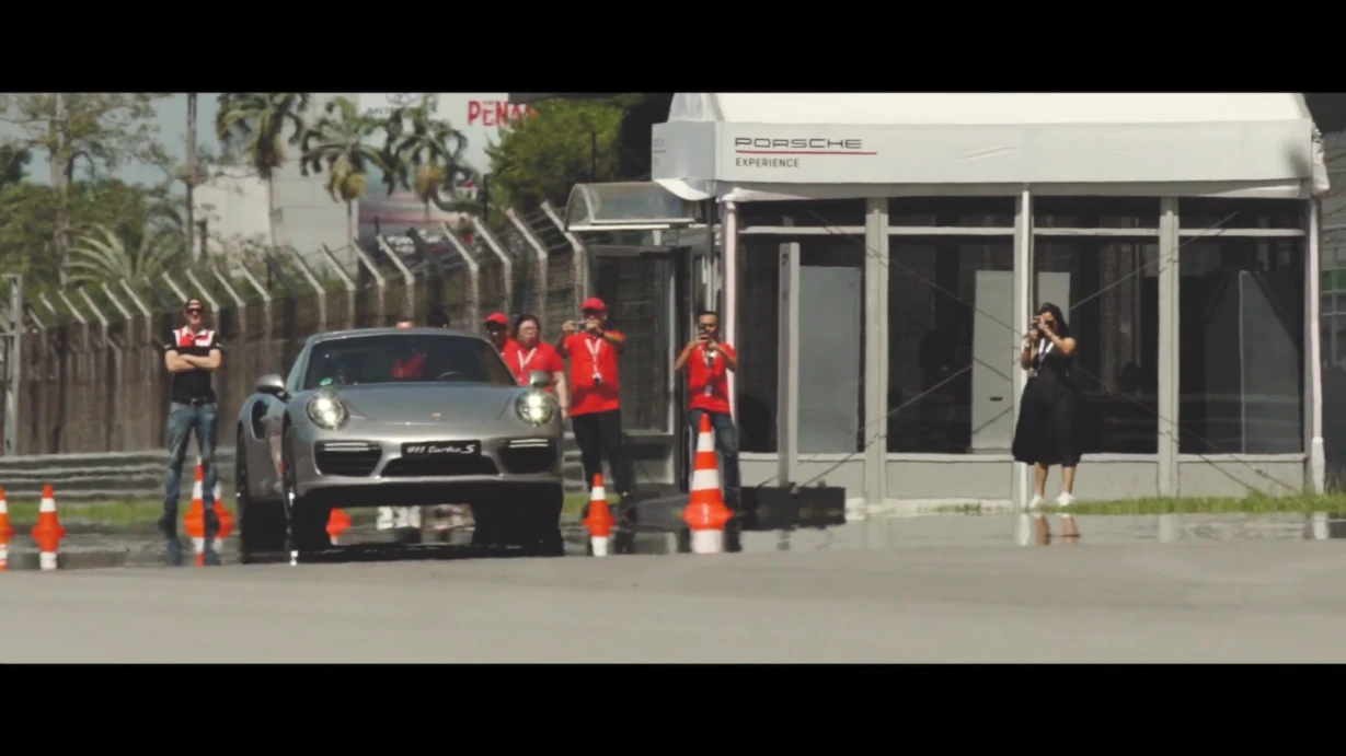 Event highlight video featuring Porsche enthusiasts driving on track during the Porsche World Roadshow in Malaysia
