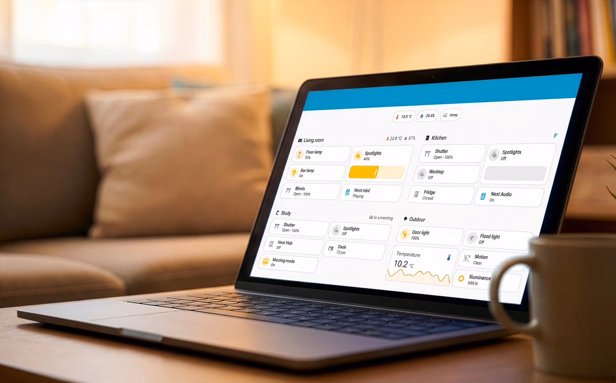 Bright living room with beige sofas and chairs, a wooden coffee table, a golden retriever, and a couple looking at a tablet by large windows showing a city skyline and river.