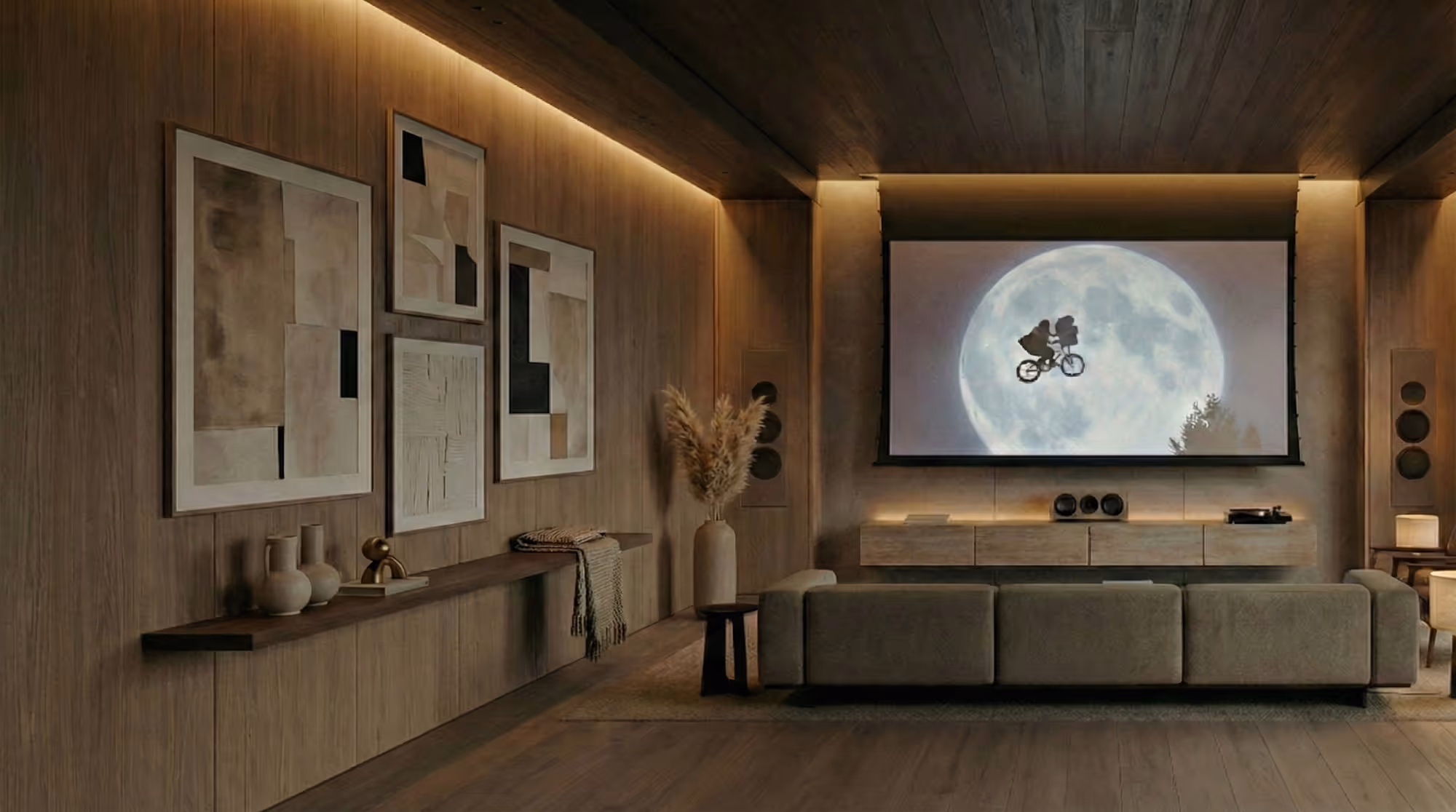 Modern home theater with wooden walls, large screen showing scene from E.T., sofa, and abstract paintings.