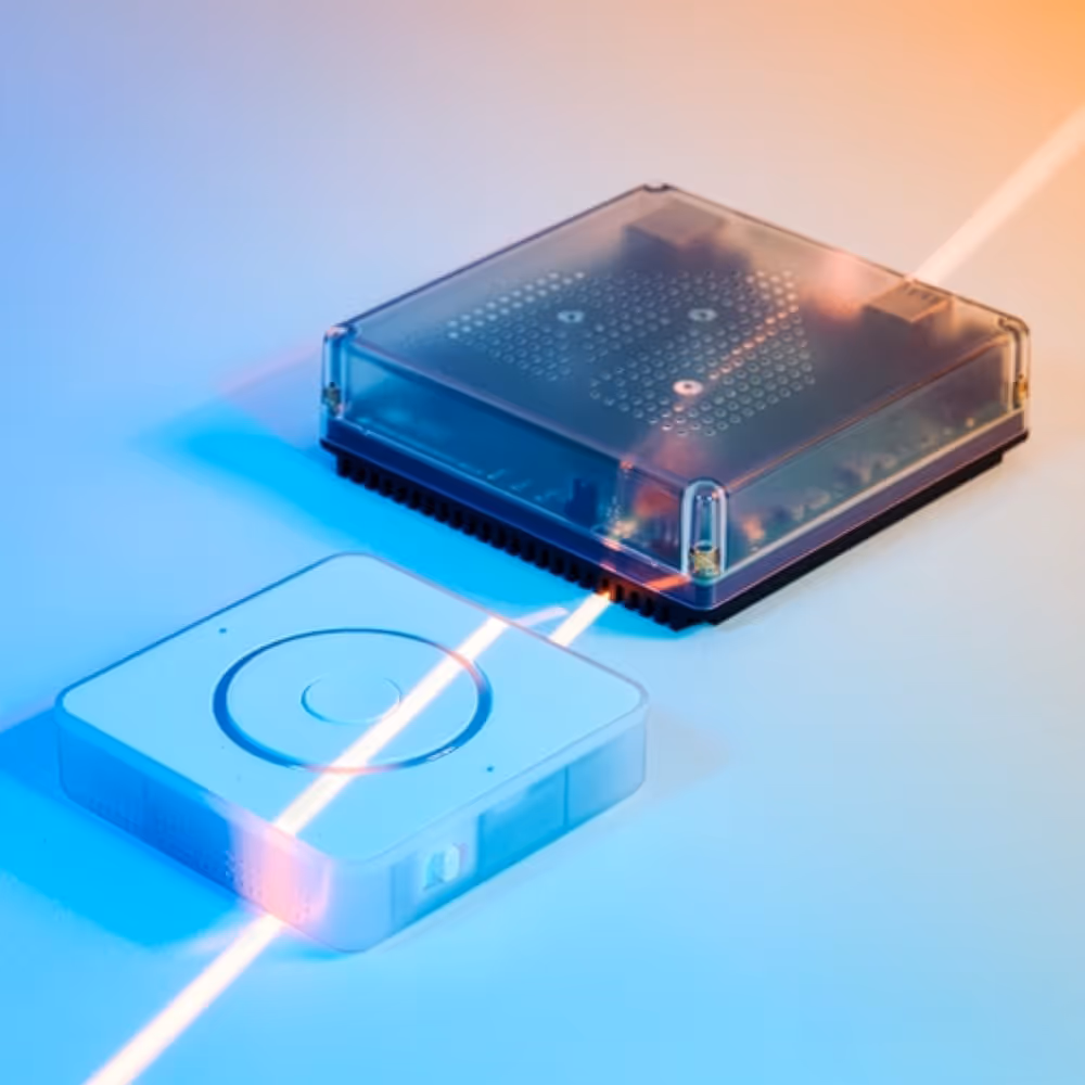Two small square electronic devices connected by a glowing diagonal beam of light against a gradient background.