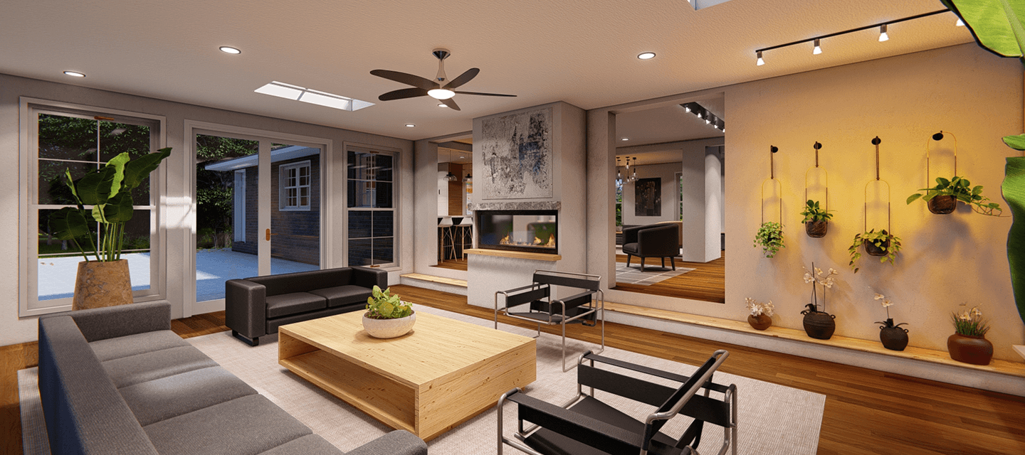 Modern living room with gray and black sofas, a wooden coffee table, indoor plants, and a double-sided fireplace.