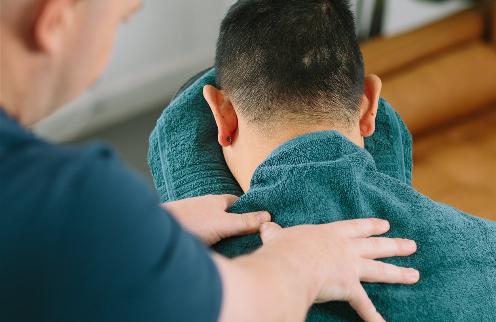 Employee receiving a fully clothed shoulder massage in a Corporate Calm chair massage session
