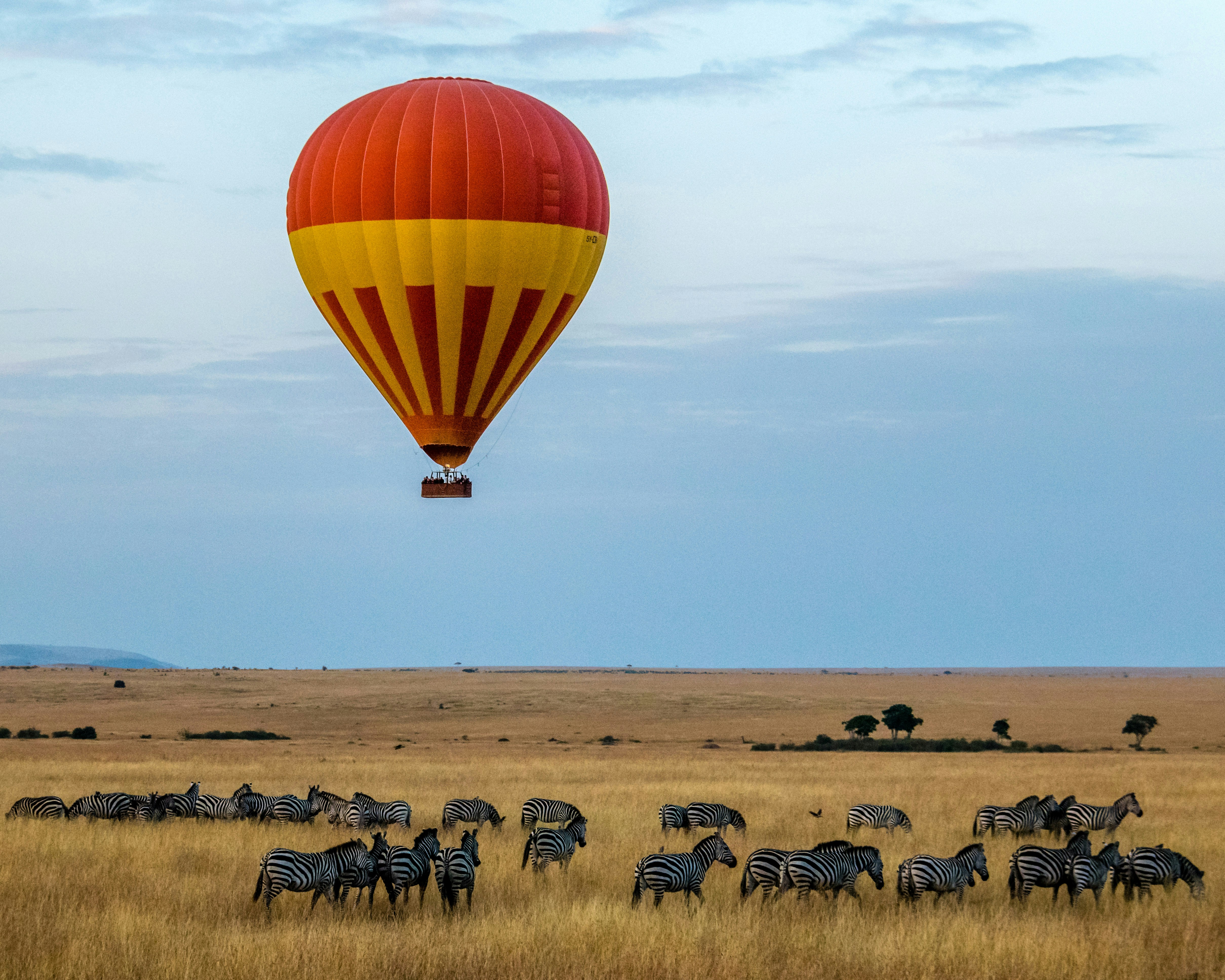 Iconic view of a hot air balloon over the Masai Mara, symbolizing the classic Kenya safari experience.