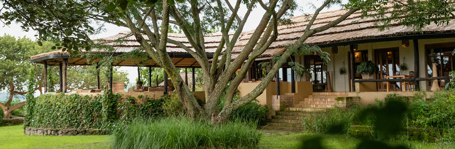 The exterior dining room of Kyambura Gorge Lodge in Queen Elizabeth National park