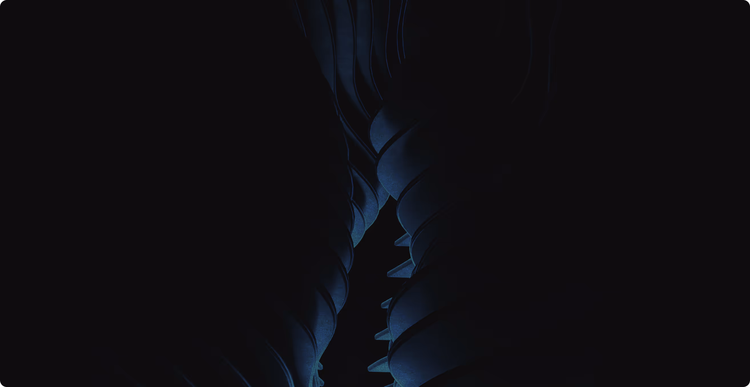 Dark, abstract close-up of curved, layered blue and black shapes resembling folded fabric or architectural forms.