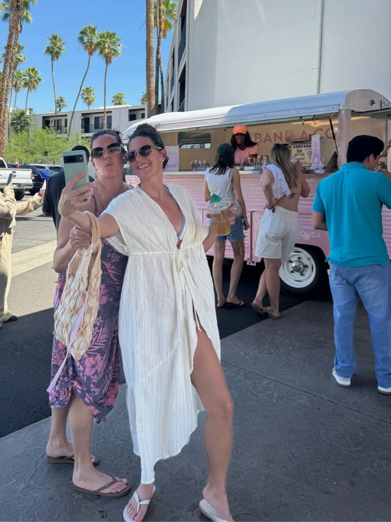Guests taking a selfie beside a Banila Co activation van as part of a social tagging and product giveaway promotion. 