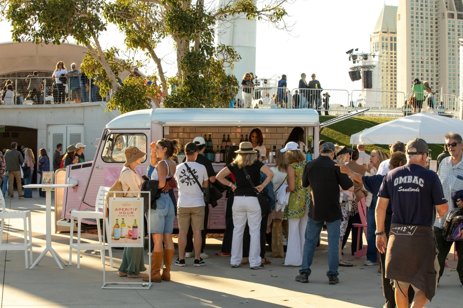 Concertgoers gathered around the pink Lo-Fi Spritz Van during aperitif hour at The Rady Shell in San Diego.