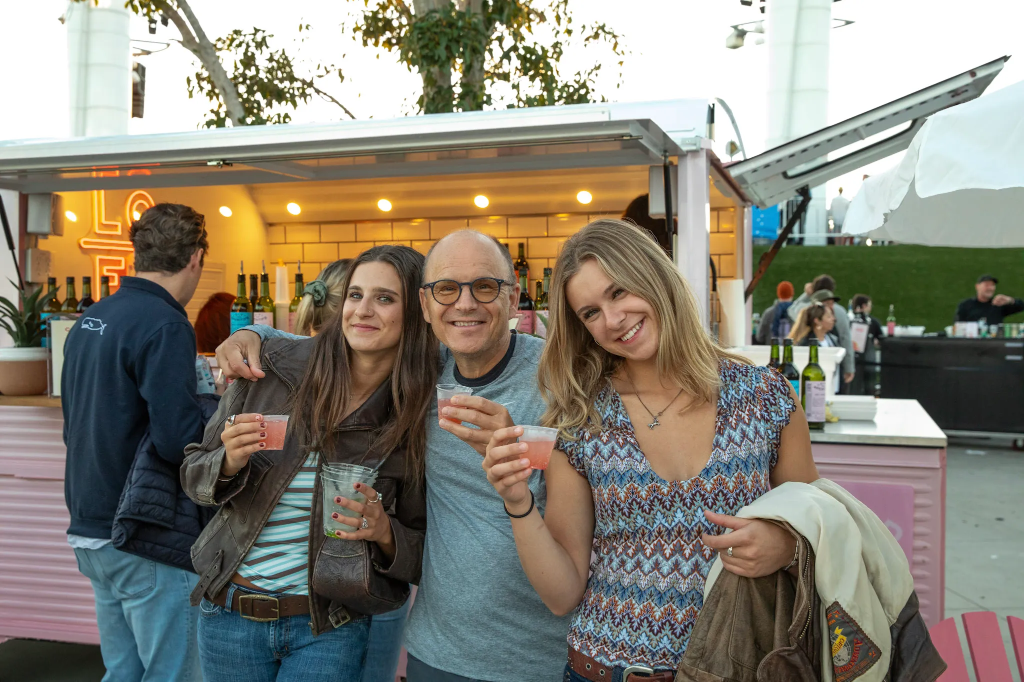 Guests enjoying Lo-Fi Aperitifs beside the branded pink Citroën HY Spritz Van at The Rady Shell in San Diego.