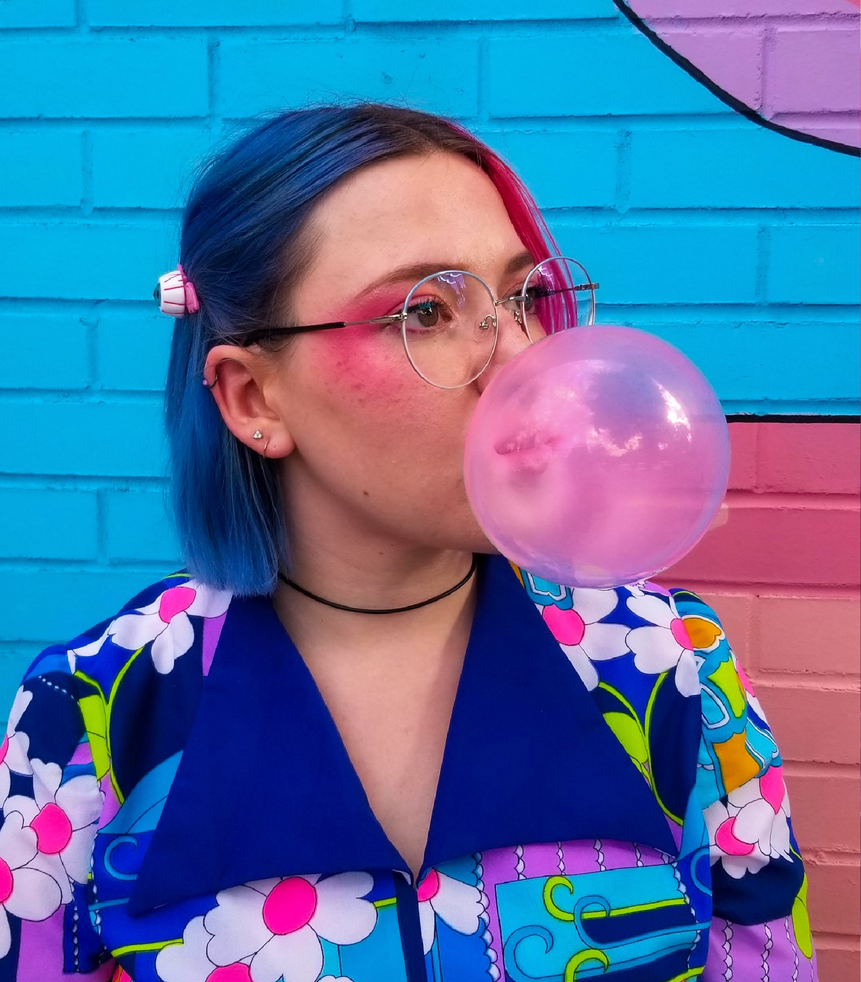 [background image] image of art supplies on a desk (for a graphic design studio)