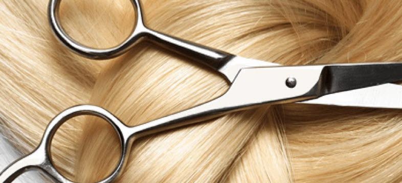 Bild på en sax och hår