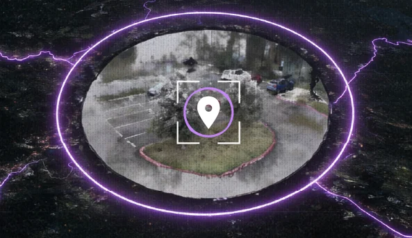 Aerial view of a parking lot area highlighted with a glowing purple ring and a location marker icon in the center.
