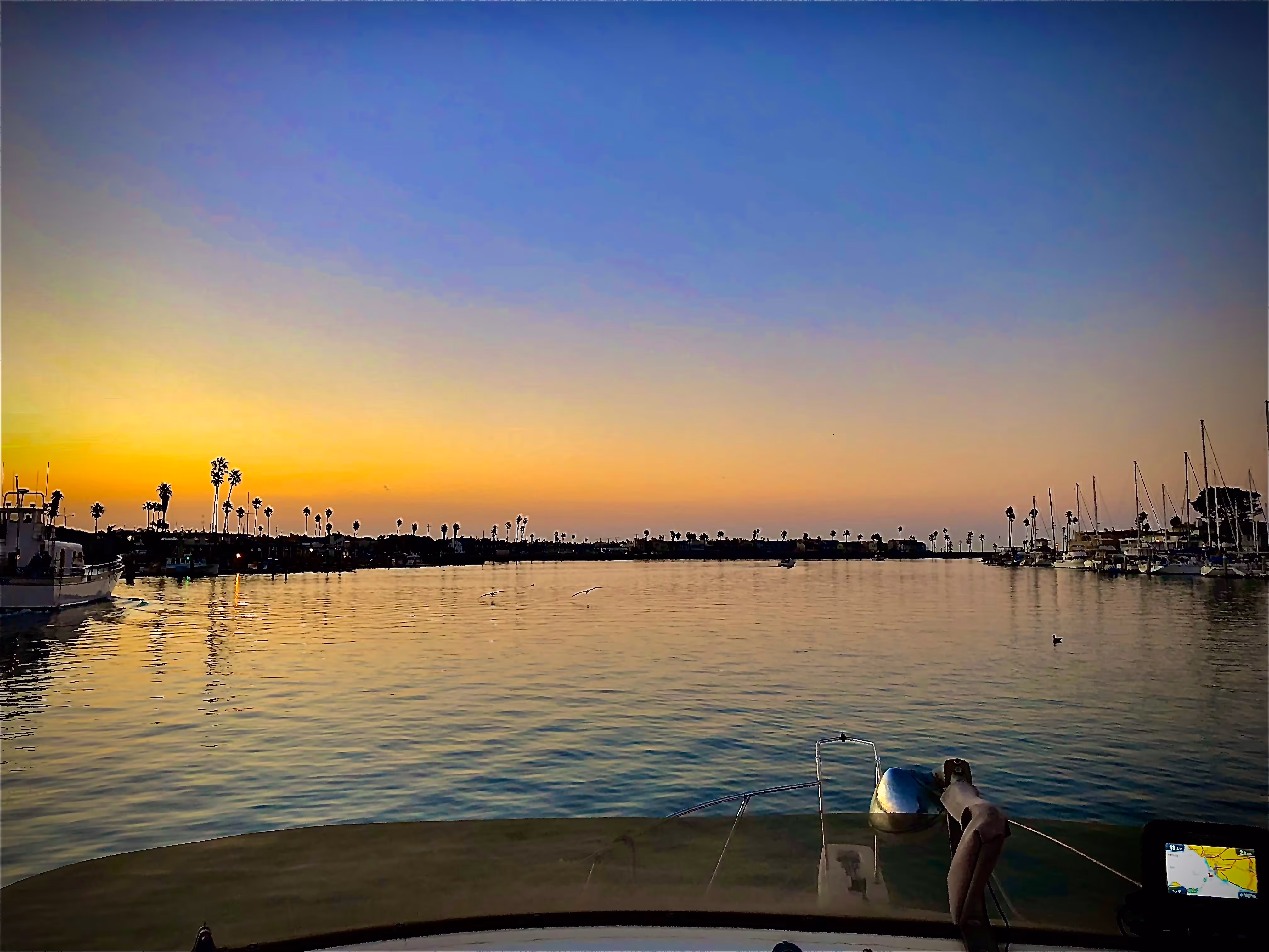 Dramatic ocean sunset viewed from a wooden pier on the California Central Coast, home to PyreBrand Designs.