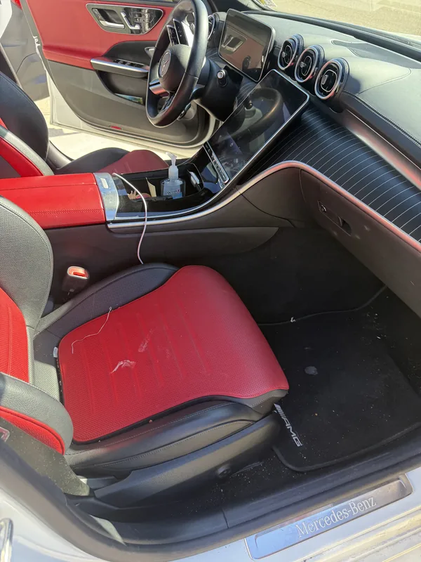 Mercedes-AMG C-Class passenger side before interior detailing in Baton Rouge