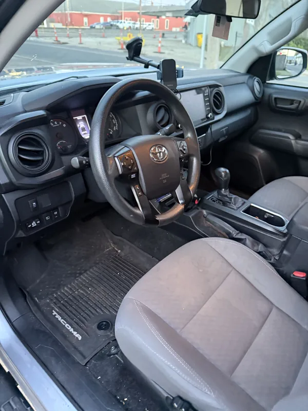 Toyota Tacoma interior before professional detailing in Baton Rouge