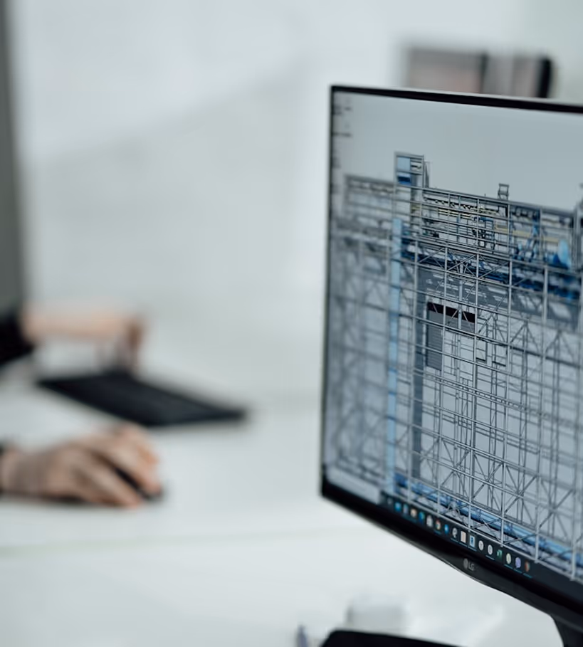 Computer screen displaying a detailed 3D architectural model of a building structure.