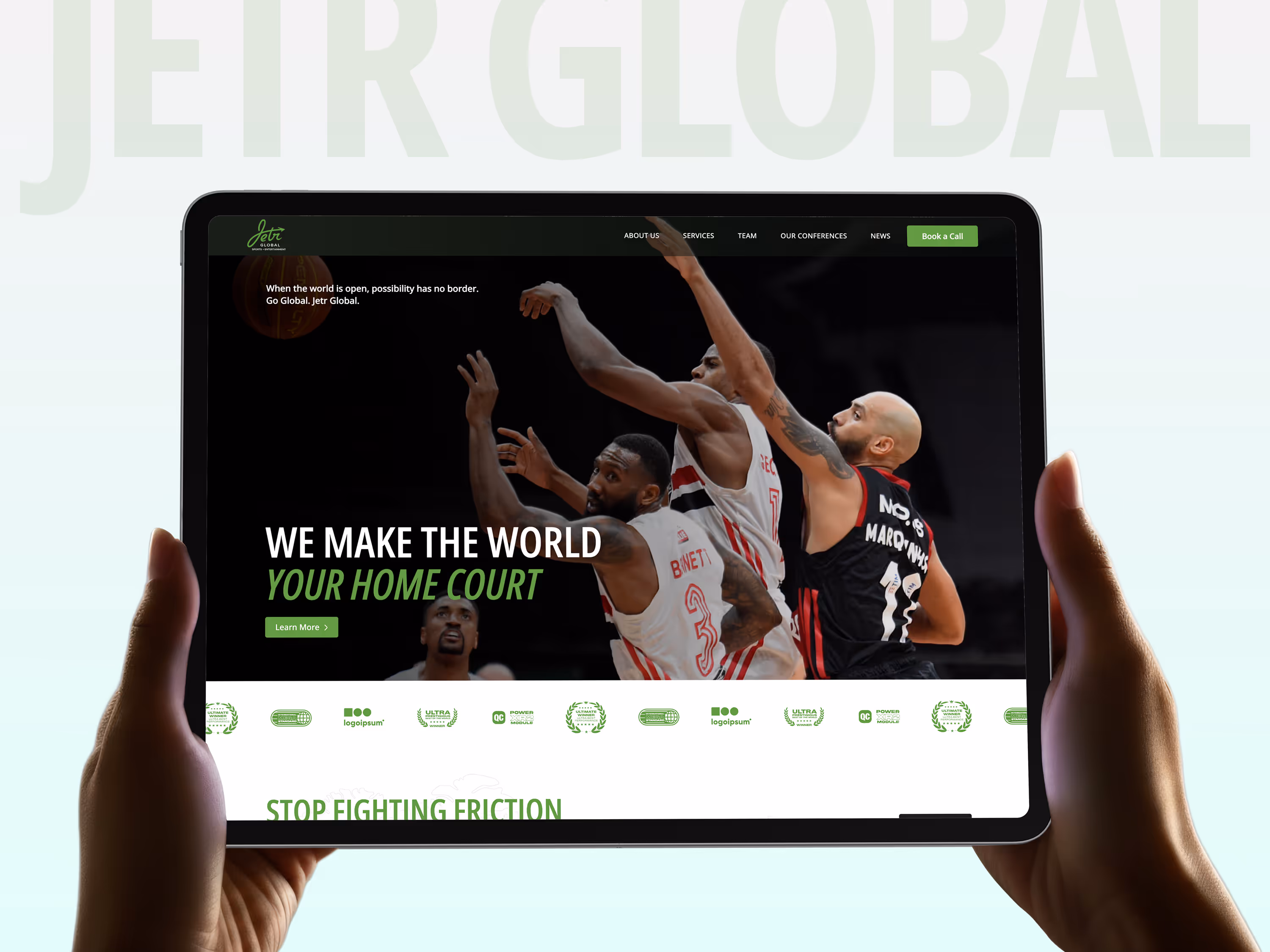 Hands holding a tablet showing a basketball website with image of three players in action and headline 'We make the world your home court.'