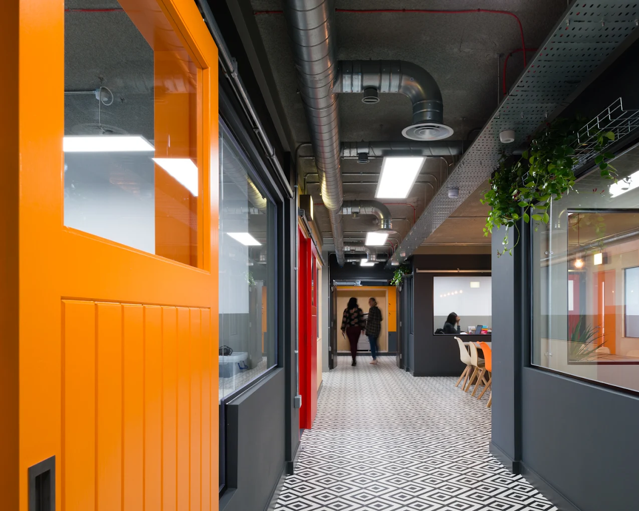 team meeting 6 people sat around a large conference table at the bright kru media office