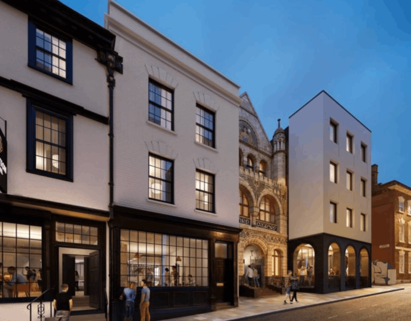Evening view of a mixed-use street with modern and historic buildings featuring large windows and people walking and dining.