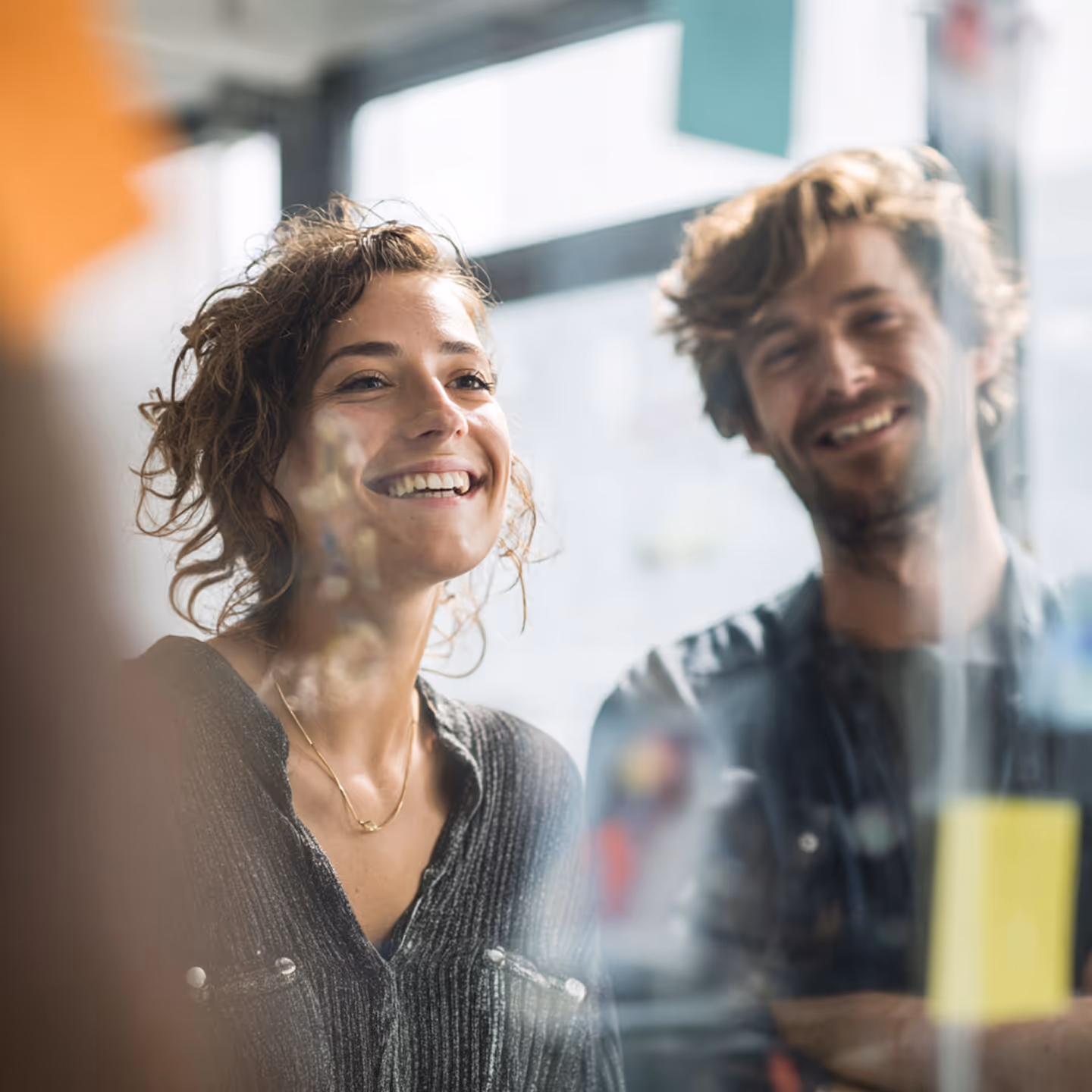 Photo - Two People Looking At A Wall With Sticky Notes