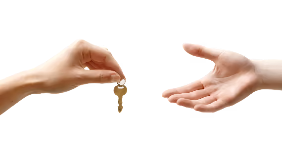 Two hands with one hand giving a key to the other hand.