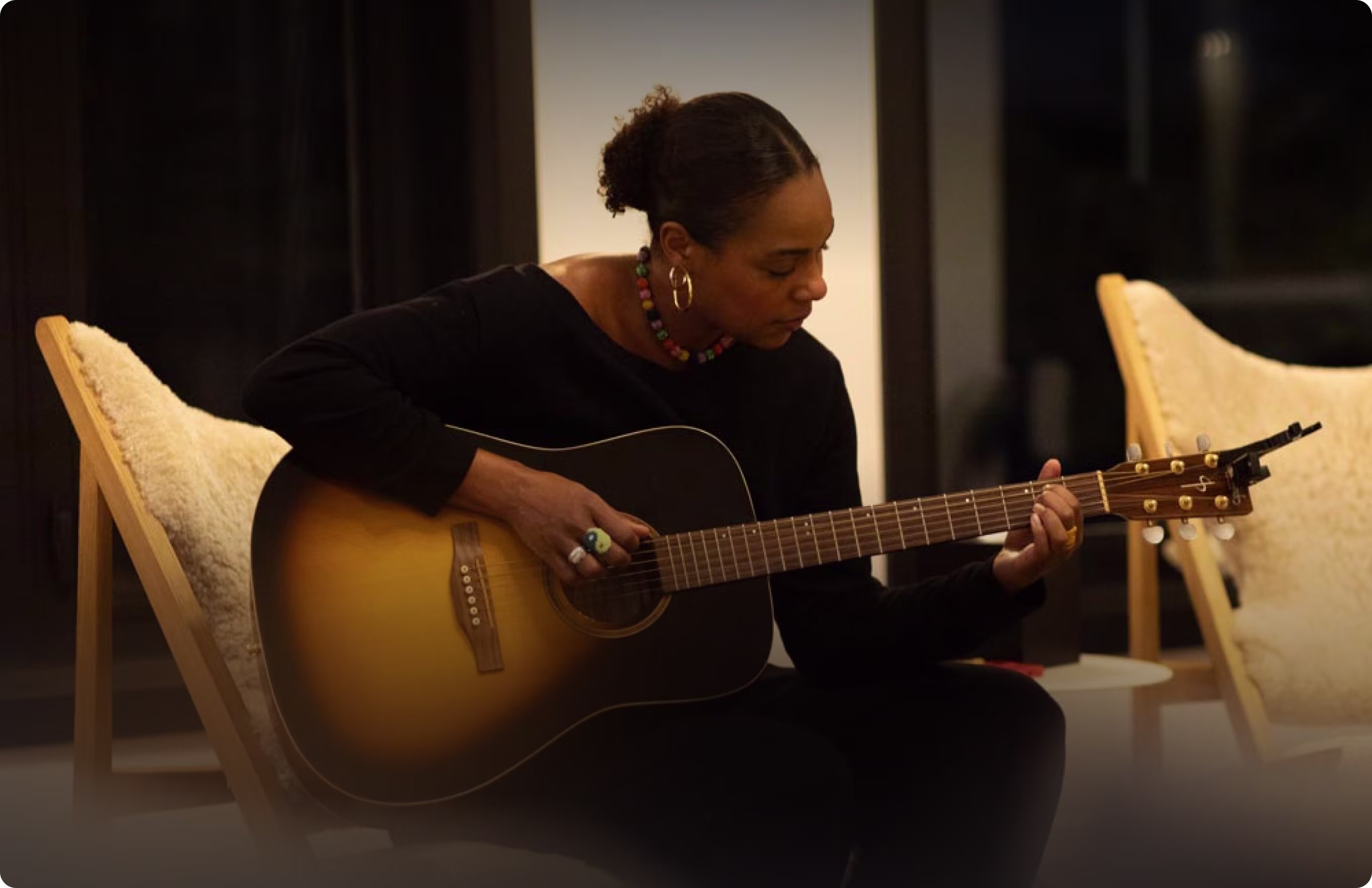 Women Playing guitar