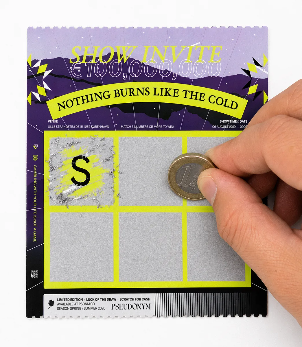 Hand scratching a PSEUDONYM Spring Summer 2020 lottery-style show invite with a one-euro coin.