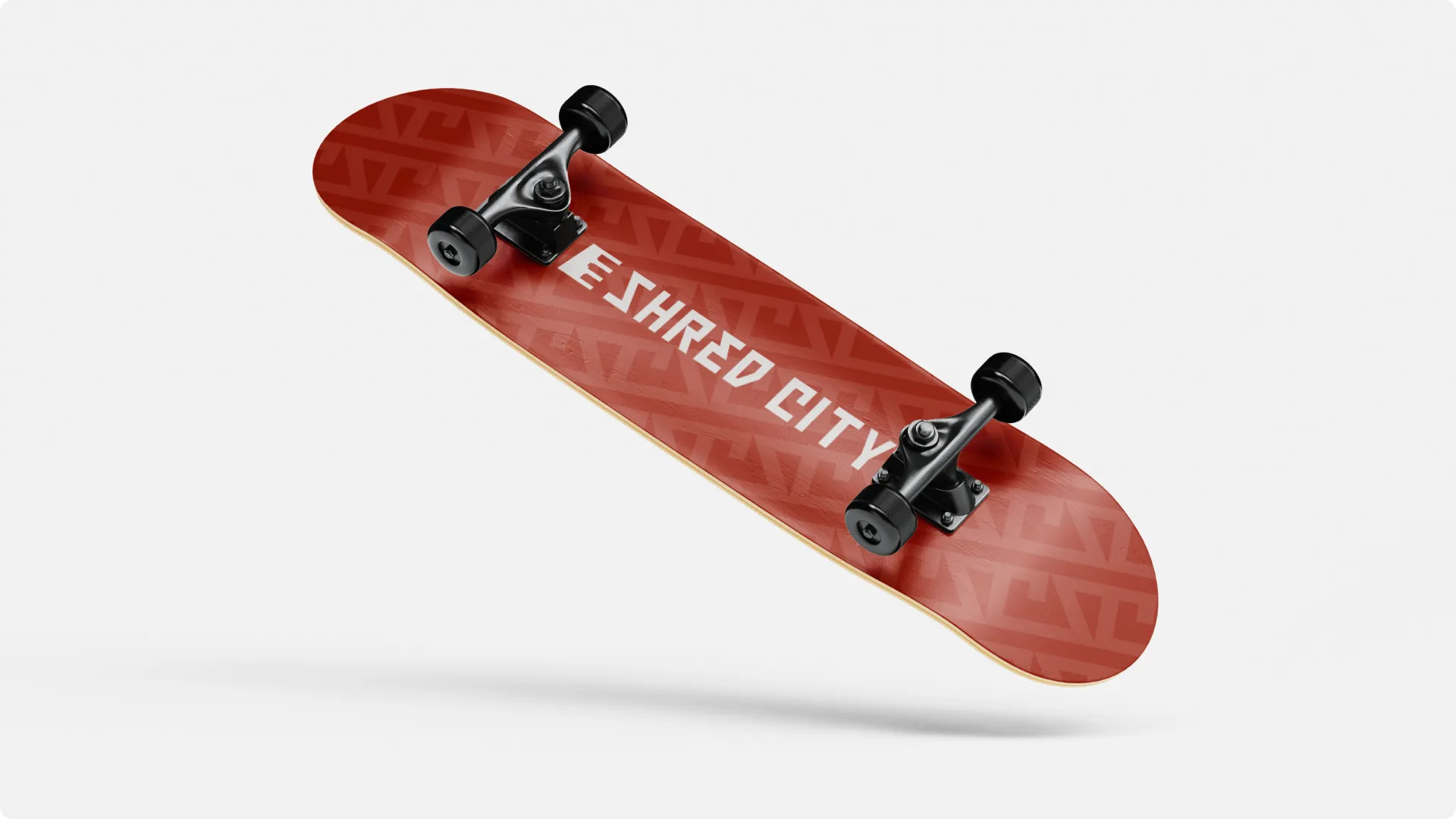 Shred City branded skateboard deck featuring red pattern and logo