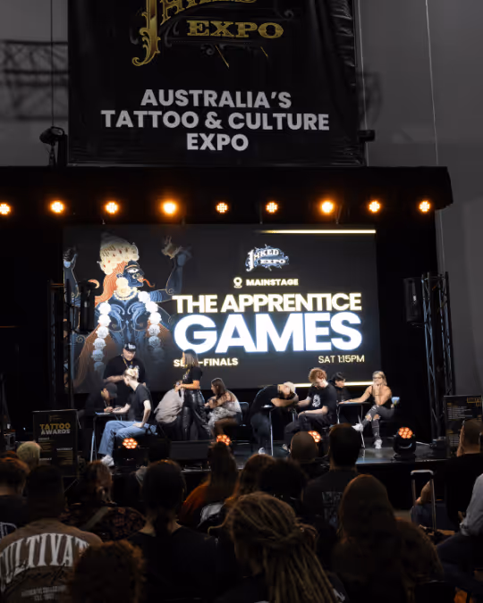 Audience watching tattoo artists on stage during the Apprentice Games semi-finals at Australia’s Tattoo & Culture Expo.