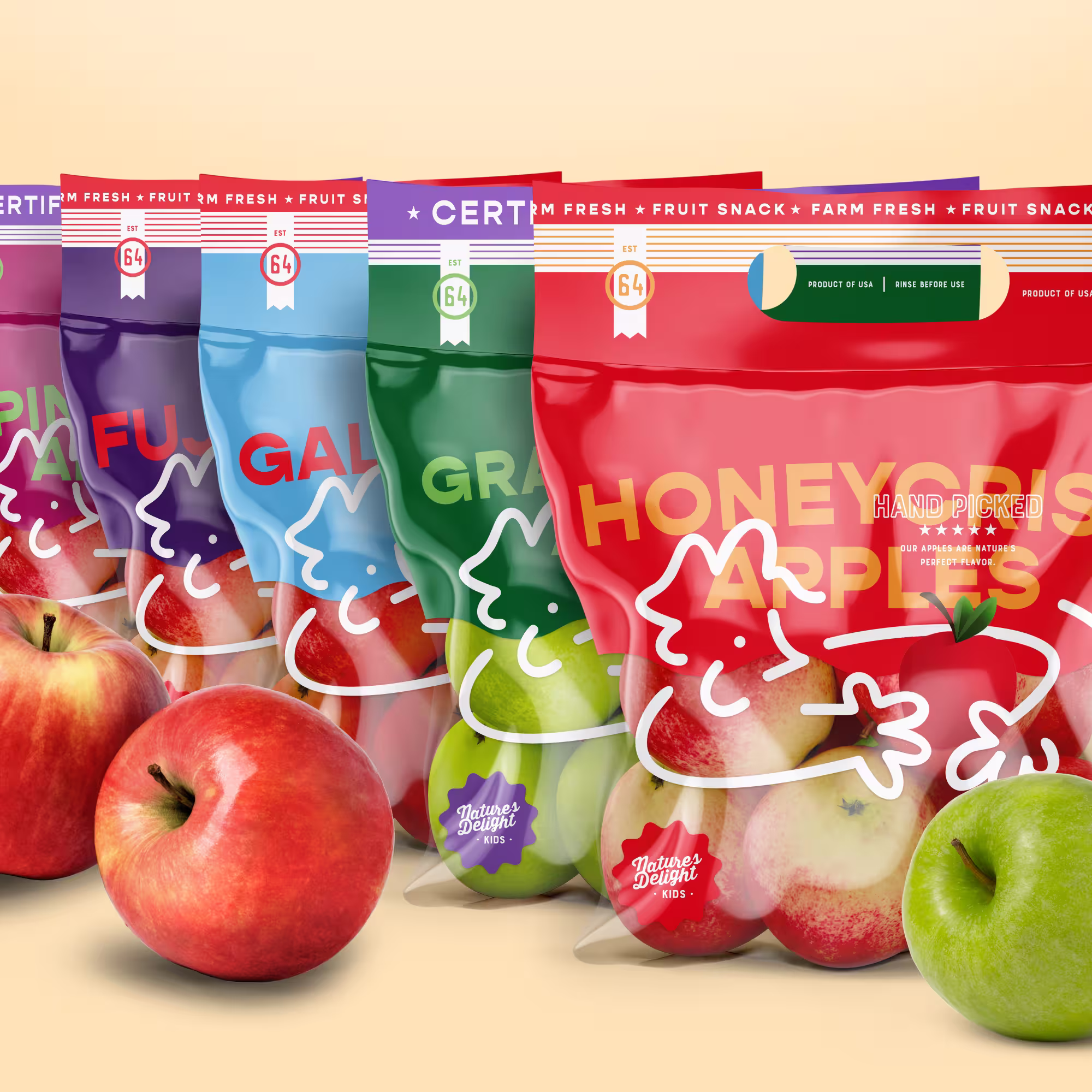 Colorful bags of Nature's Delight Kids apples showcasing various apple varieties with fresh whole apples in front.