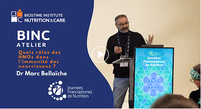 Man giving a presentation at BINC Atelier event by Biostime Institute on the role of HMOs in infant immunity.