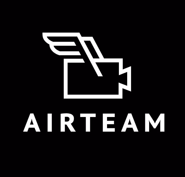 White outline of a video camera with a wing on a black background above the word AIRTEAM in bold white letters.