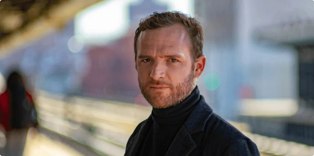 Man looking stern at camera.