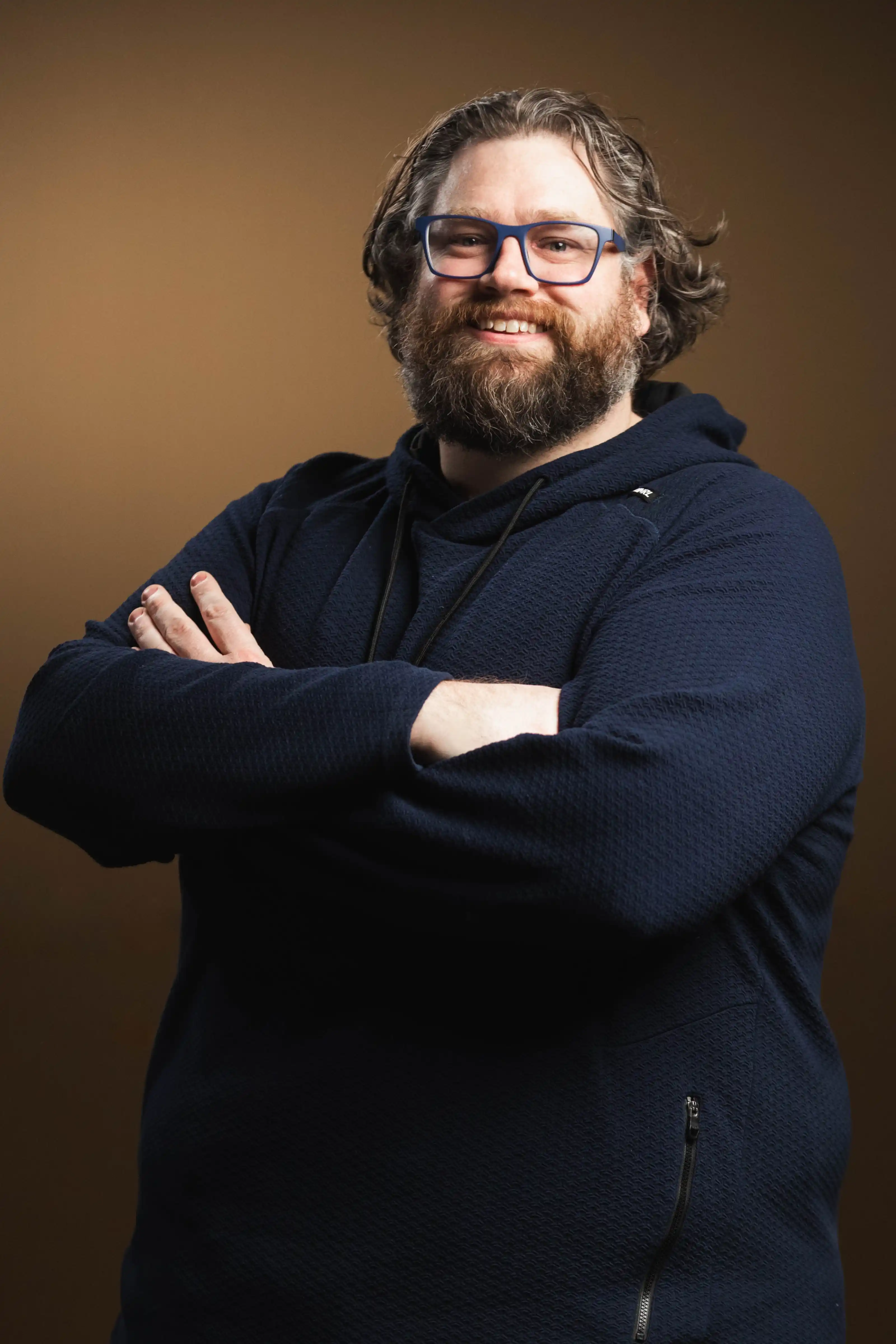 Congregation standing and singing during a church service with a worship band on stage.