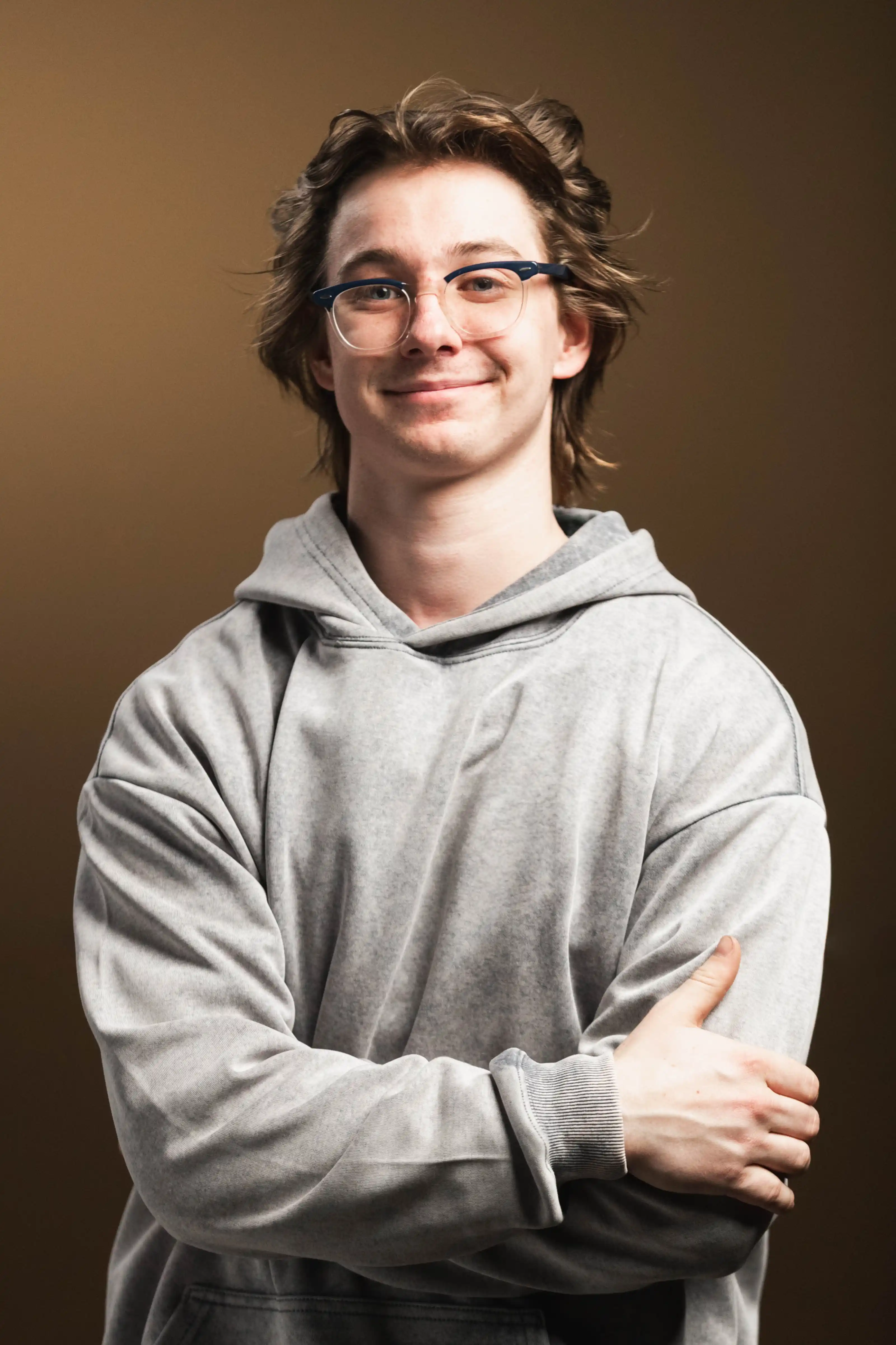Congregation standing and singing during a church service with a worship band on stage.