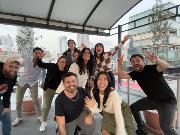 Wandr team group photo on a rooftop terrace
