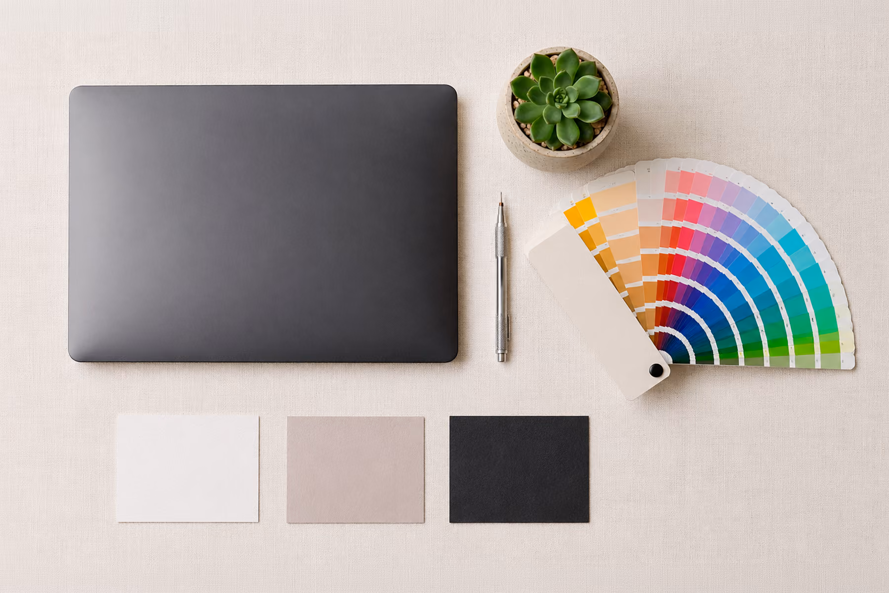 Organized designer's flat lay with color swatches and tools, representing the coherence and intentionality behind great website design