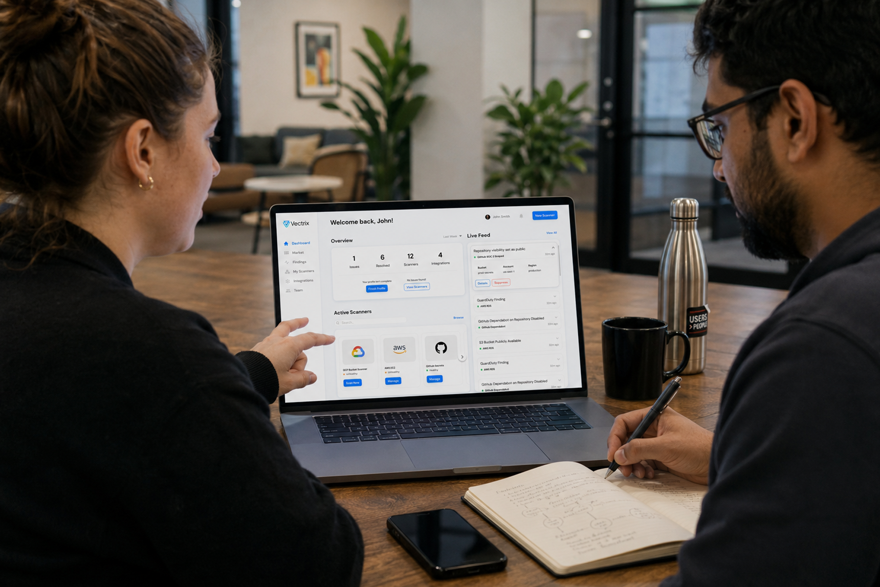 UX strategy session with SaaS dashboard UI displayed on laptop surrounded by research documents