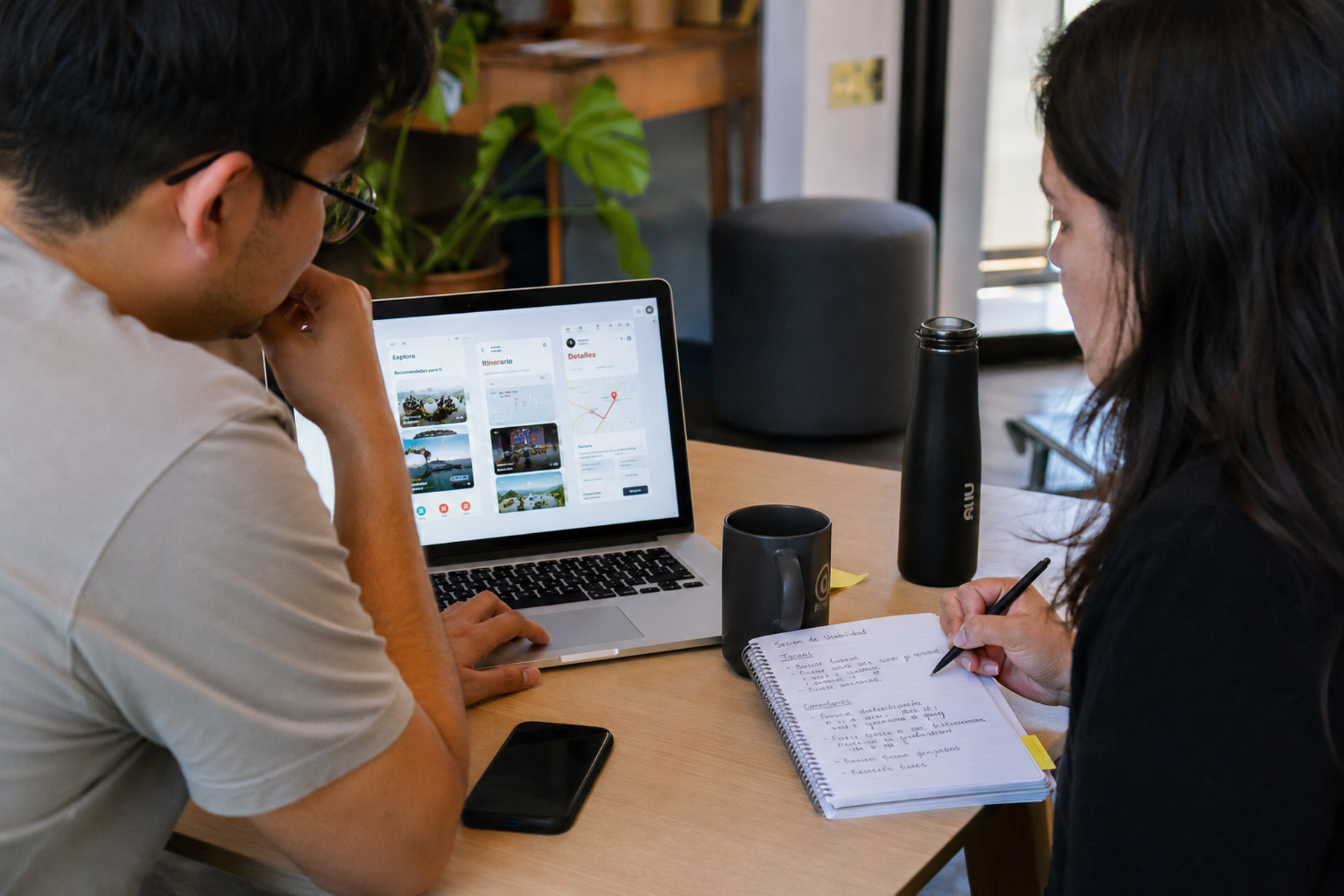 UX researcher conducting startup usability testing session with participant interacting with mobile app prototype