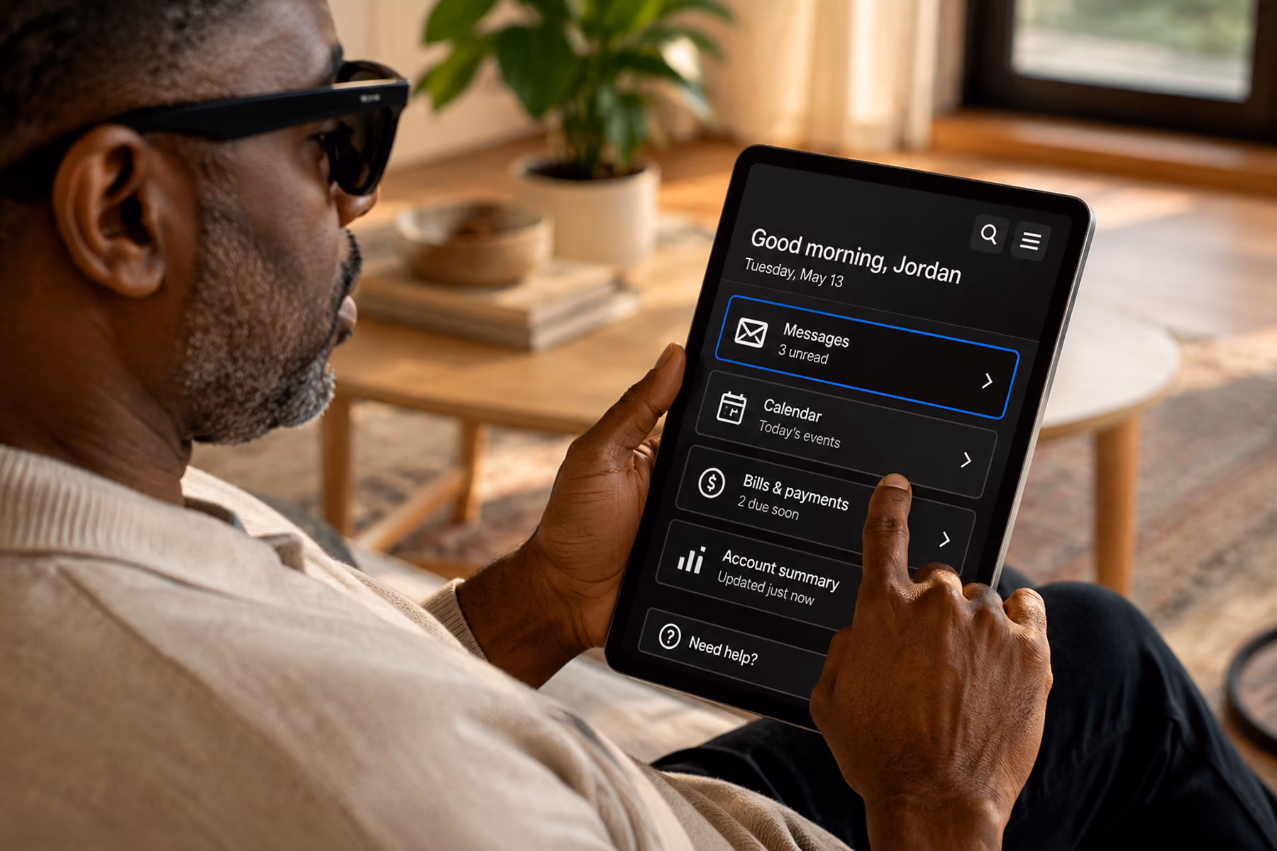 Person with visual impairment using a tablet with accessible high-contrast UI showing inclusive design best practices