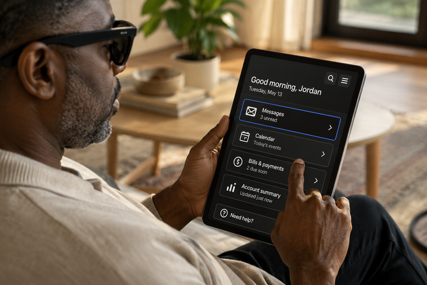 Person with visual impairment using a tablet with accessible high-contrast UI showing inclusive design best practices