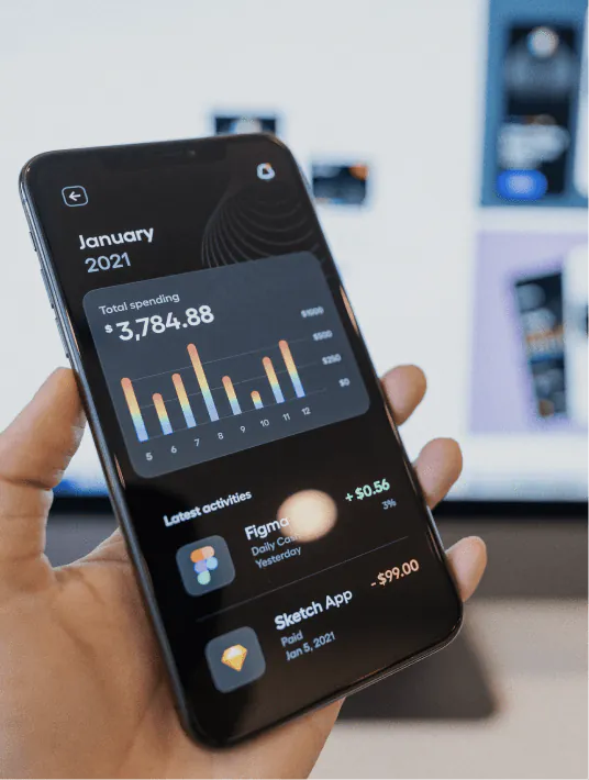 A UX designer creating a modern Fintech application interface featuring bright colors, personalized layouts, and glassmorphism design elements.