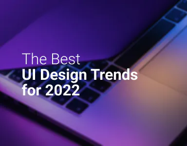 A UI designer working on a modern website interface featuring bold typography, smooth gradients, glassmorphism effects, and vivid colors representative of the top UI design trends for 2022.