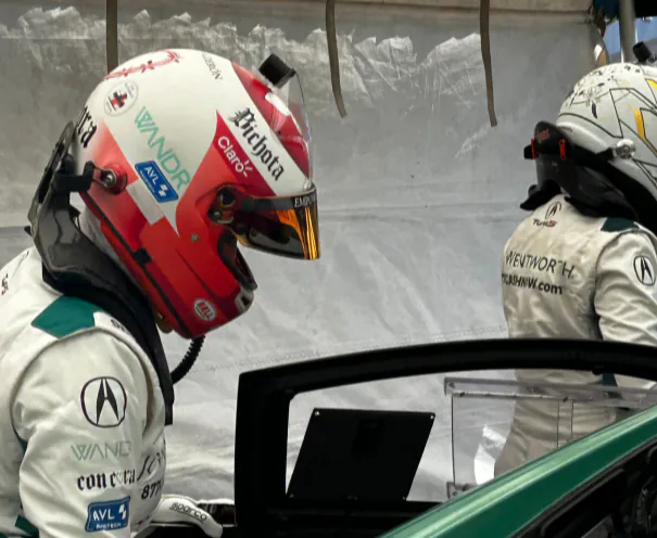 WANDR team members and racing driver Tatiana Calderón at the Sebring 6H race, representing the collaboration between motorsport performance and user experience design innovation.