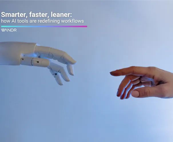 A product design team integrating AI tools into their workflow on laptops and digital screens, representing how artificial intelligence is streamlining design, research, and project management processes.
