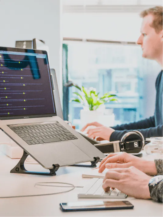 Government technology team reviewing digital transformation strategy on screens displaying data dashboards, cloud infrastructure diagrams, and citizen service platforms